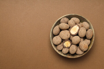 Tasty and sweet food - almonds in chocolate
