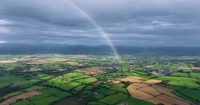 Excellent aerial footage of half of rainbow over a field in Kilkenny Ireland 