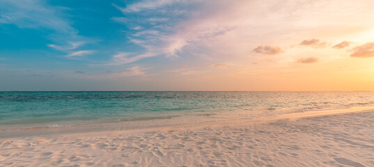 Beach sunset. Beautiful panoramic landscape, colorful golden sunset sky clouds. Closeup calm sea...