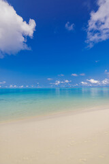Tropical beach view. Closeup sea calm relax sea waves. Sunny blue sky clouds over seascape, white sand. Tranquil peaceful nature concept. Meditation inspiration Mediterranean coast panoramic landscape