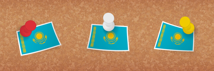 Kazakhstan flag pinned in cork board, three versions of Kazakhstan flag.