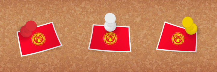 Kyrgyzstan flag pinned in cork board, three versions of Kyrgyzstan flag.