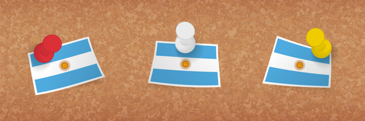 Argentina flag pinned in cork board, three versions of Argentina flag.
