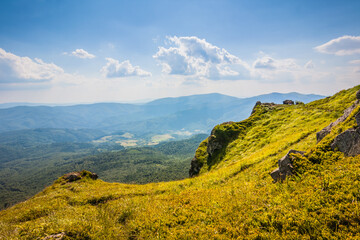 Beautiful view of the Ukrainian mountains Carpathians and valleys.Beautiful green mountains in summer with forests, rocks and grass. Water-making ridge in the Carpathians, Carpathian mountains