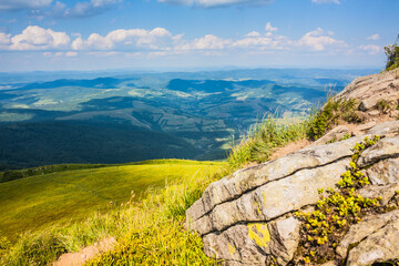 Beautiful view of the Ukrainian mountains Carpathians and valleys.Beautiful green mountains in summer with forests, rocks and grass. Water-making ridge in the Carpathians, Carpathian mountains