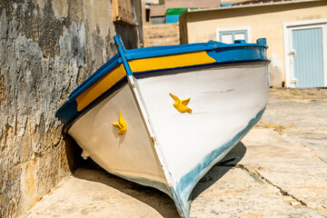 old colorful painted wooden fishing boat