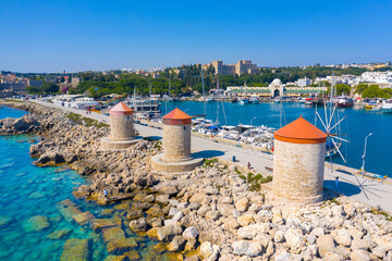 Mandraki port with fort of St. Nicholas and windmills, Rhodes, Greece. 