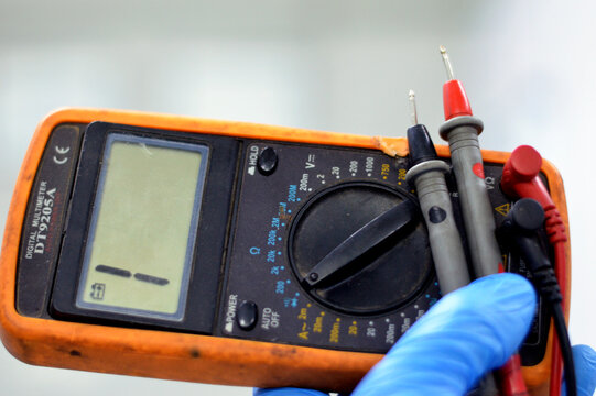 Cairo, Egypt, July 27 2023: DT9205A A digital multimeter, a test tool used to measure two or more electrical values, principally voltage (volts), current (amps) and resistance (ohms), selective focus