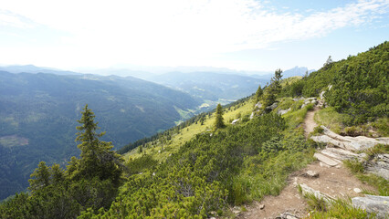 Reiteralm loop hiking trail with views on the Dachstein Mountains in Schladming, Austria.