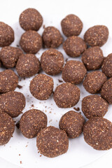Chocolate cocoa ball cookies served on the plate with copy space
