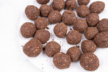 Chocolate cocoa ball cookies served on the plate with copy space