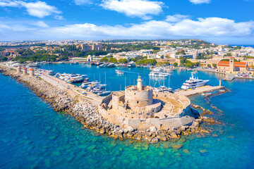 Mandraki port with fort of St. Nicholas and windmills, Rhodes, Greece.  - 631060845
