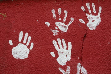 Background of hand prints on a wall