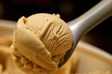 Scoops of ice cream in a bowl on a black background