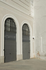 Fototapeta na wymiar wall with two semicircular doors
