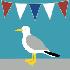 A lone seagull standing on a harbour wall. The bird is standing below some red, white and blue celebration bunting that has been hung around the harbour for the summer.