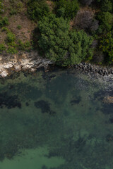Aerial view to a rocky beach at sunset	