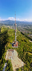 Vertical Panorama of Almaty city with TV tower in Kazakhstan
