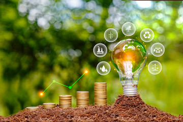 Green tree growing on pile of gold coins. light bulb on green nature background green energy icon around it. Investing in the environment, society, governance. ESG Investing in the industrial. - obrazy, fototapety, plakaty