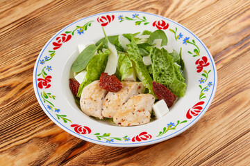 caesar salad on the wooden background