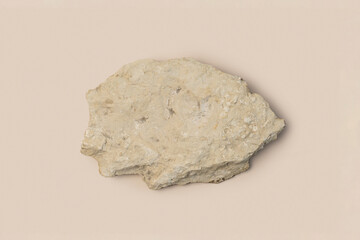 Stone Podium for promotion on beige Background. Natural rock pedestal. Beauty product mockup. Scene to show products. Showcase, display case. Top View soft shadow Flat lay. Trendy neutral color. Space