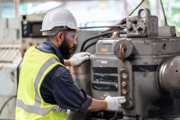 Arabic engineer man repair machine in steel metal manufacturing factory plant industry. technician worker maintenance check quality machine.