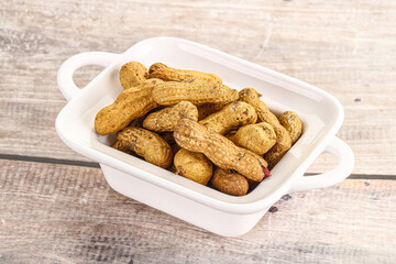 Raw ripe unpeeled peanut heap