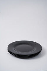 black ceramic plates on white background