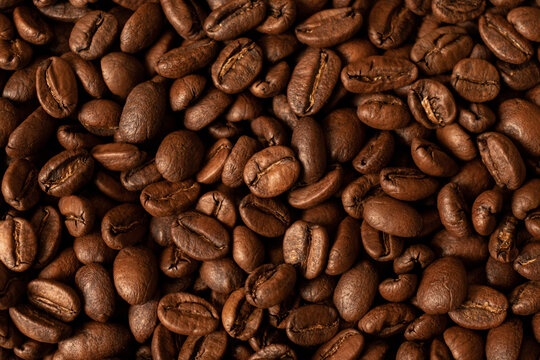 Background of roasted coffee beans with pleasant aroma