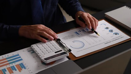 Company finance staff preparing financial documents, company finance staff preparing company finance documents to bring to the meeting to summarize for management's acknowledgment. Financial concept.