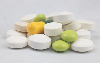 Colored tablets - medicines for the treatment of various diseases - medication addiction