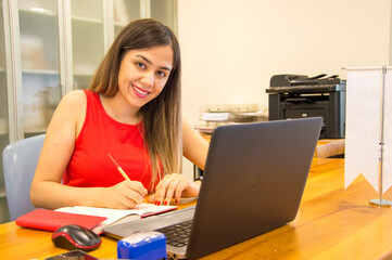 Businesswoman with computer in office