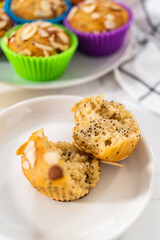 Lemon poppy seed muffins garnished with almond slivers