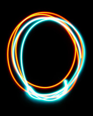 Number 0 of the alphabet made from neon sign. The blue red light image, long exposure with colored fairy lights, against a black background. Concept of design