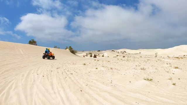 Quad biking at Lancelin Sand Dunes, Western Australia.