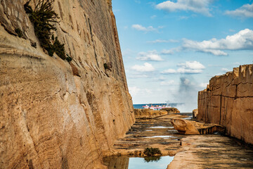 The moat cut into the rock between the old Fort St Elmo and the Mediterranean Sea is today a hiking...