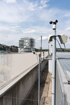 Weather equipment and alarm system on the building. Meteorological equipment is installed on the roof of the building. Alarm sensors and additional equipment.