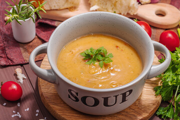 Chickpea-tomato cream soup with fragrant garlic buns. Comfort food, nostalgic mood concept