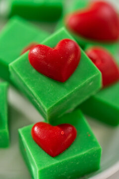 Green fudge with red hearts © arinahabich