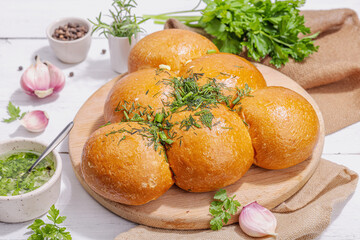 Aromatic garlic buns. Fresh baked goods, a traditional gluten-free soup snack. Parsley, spices