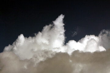 white coluds flying in the sky