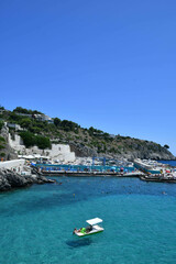 Obraz premium View of the small bay overlooked by a small village in the province of Lecce, Italy.