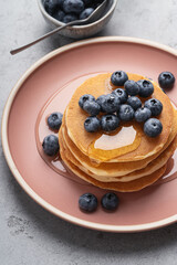 Pancakes with blueberries and honey