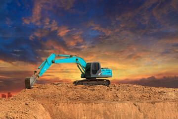 Crawler Excavator digging the soil,In the construction site on the sunset sky background