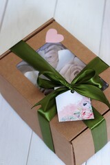 Homemade marshmallows in a paper gift box. Zephyr flowers. The box is tied with a ribbon tied into...