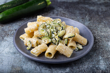Macaroni pasta with zucchini and ricotta cheese. Perfect for vegetarian and healthy diet.