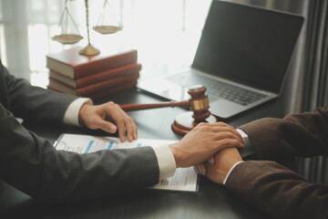 Judge gavel with Justice lawyers having team meeting at law firm background. Concepts of Law and...