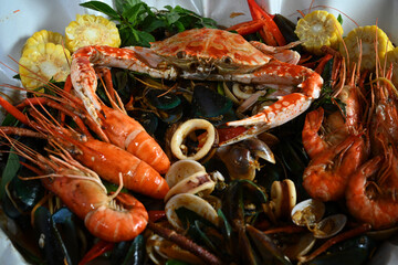 Seafood mixed on paper plate with top view