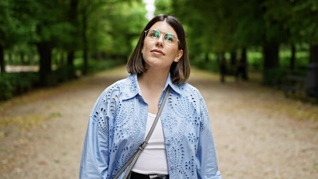 Young Beautiful Hispanic Woman Walking Smiling At The Park In Vienna