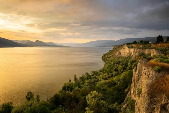 Idyllic scene of a cliff overlooking Okanagan Lake and Naramata Bench at sunset